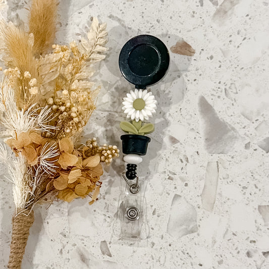 Flowerpot Daisy Badge Reel | Black