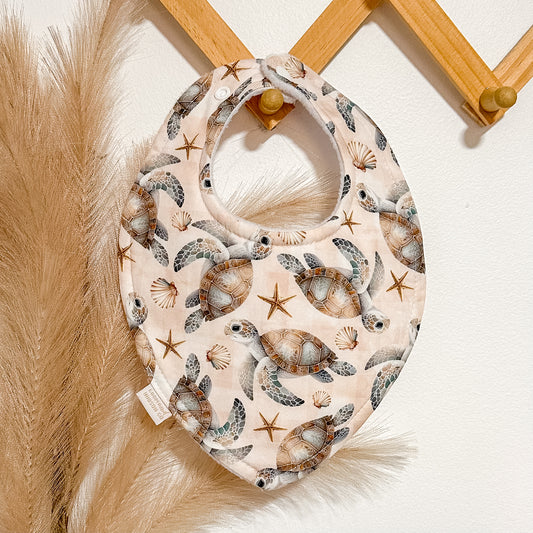 Beige Turtle Bibs