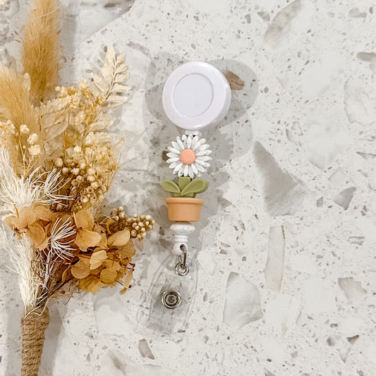 Flowerpot Daisy Badge Reel | Peach