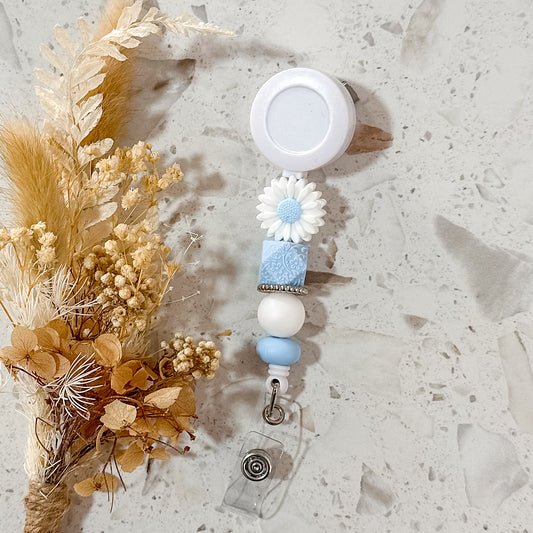 Daisy Badge Reel | Blue Embossed